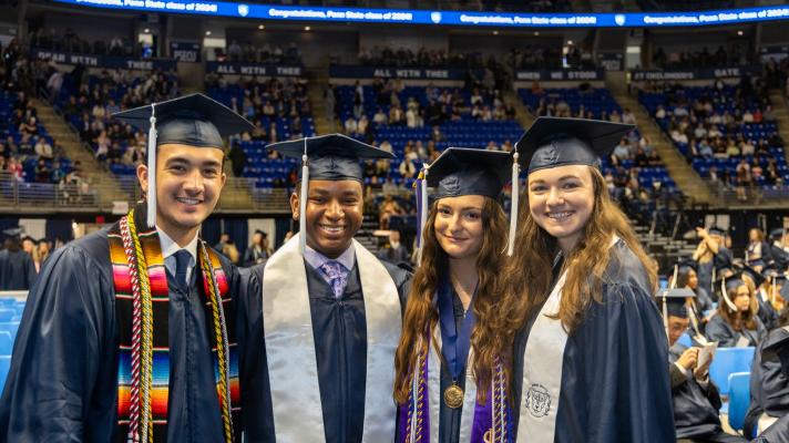 Four students at graduation